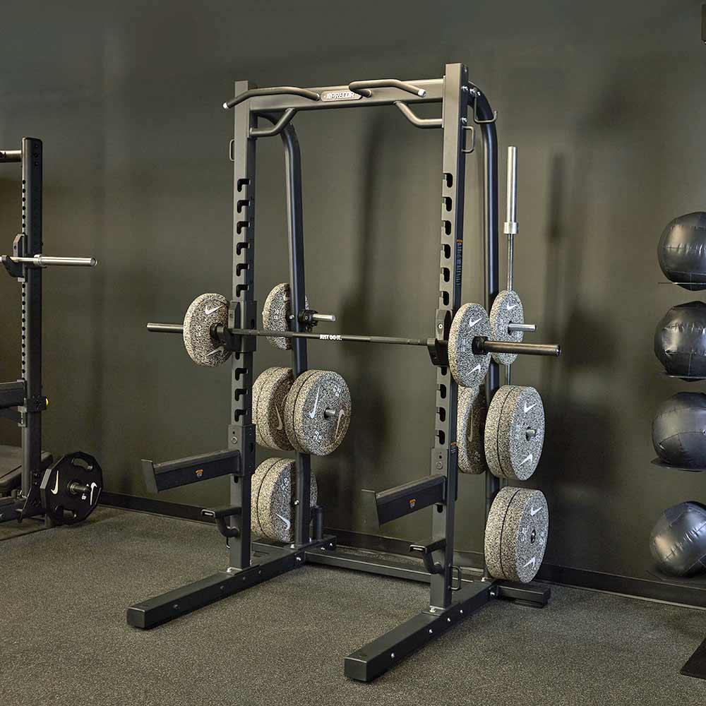 Precor DBR-611 Half Rack shown in a professional strength training facility