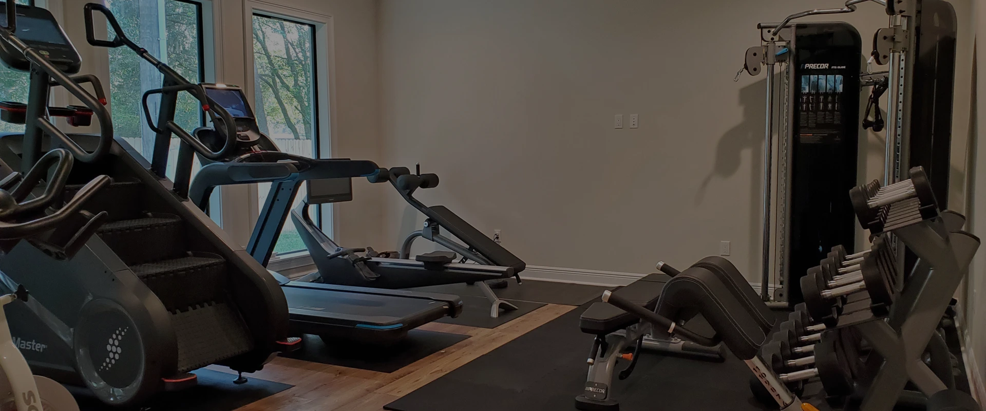 Premium home gym design in Odessa, Florida with Precor and StairMaster equipment