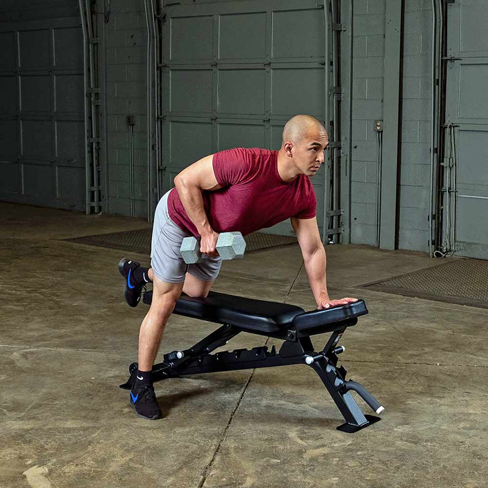 Body-Solid SFID325B adjustable bench used for dumbbell lat pull rowing exercise
